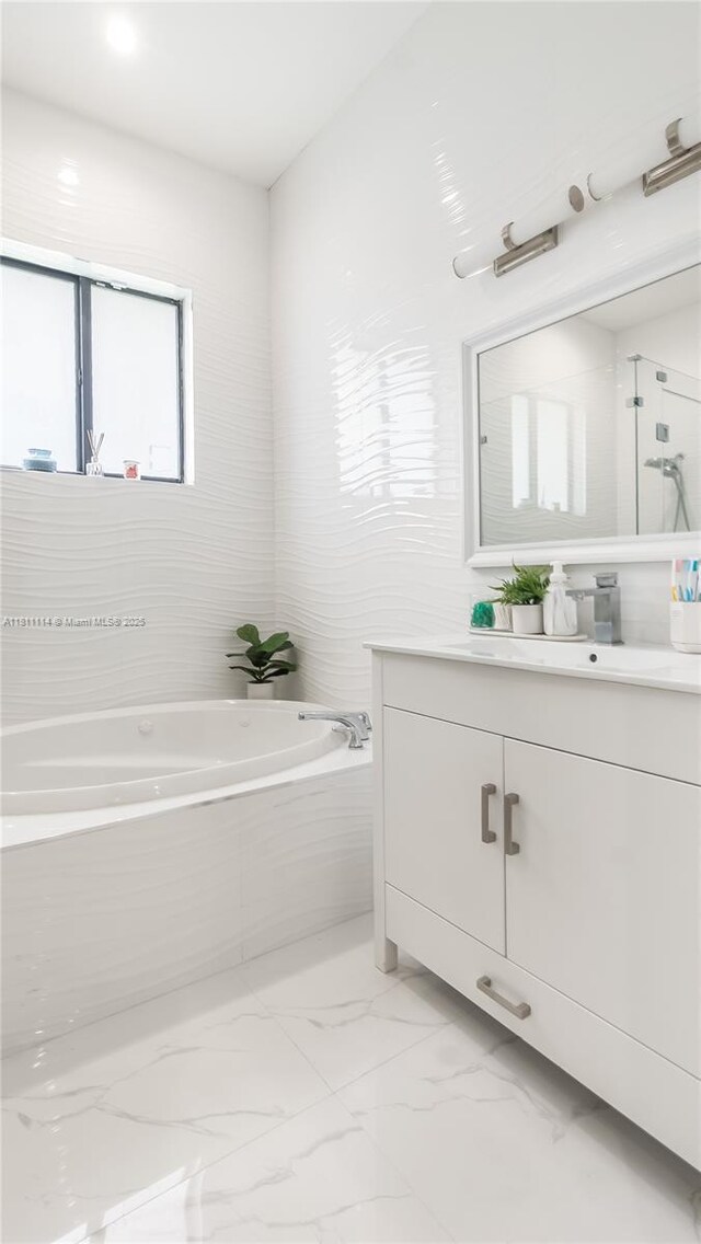19120 SW 127th Pl, Miami, FL 33177 - bathroom with vanity, a garden tub, and marble finish floors
