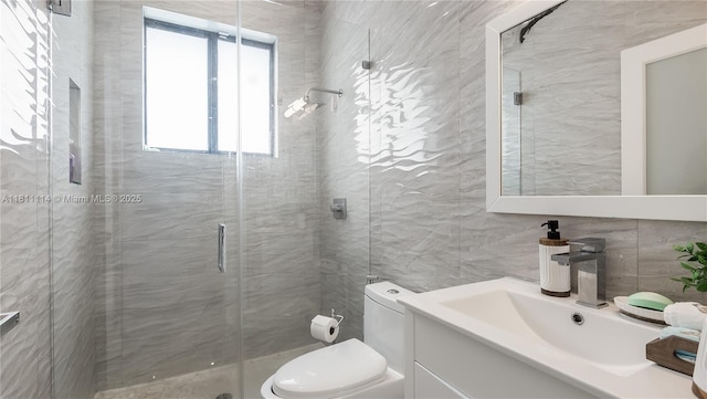19120 SW 127th Pl, Miami, FL 33177 - bathroom featuring vanity, tile walls, toilet, and a stall shower