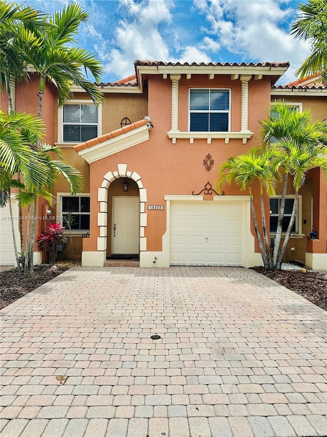 15222 SW 30th Ter, Miami, FL 33185 - view of front of house featuring a garage, decorative driveway, and stucco siding