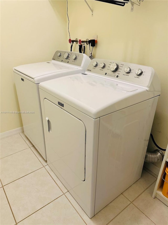 15222 SW 30th Ter, Miami, FL 33185 - laundry area with separate washer and dryer and light tile patterned flooring