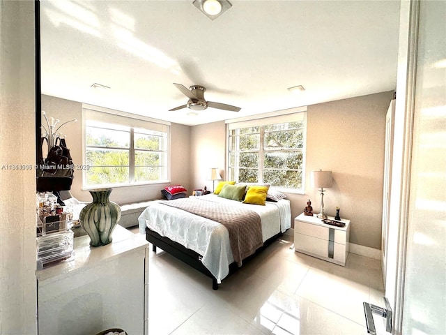 9350 Fontainebleau Blvd Unit 414, Miami, FL 33172 - bedroom featuring light tile patterned floors, baseboards, and a ceiling fan