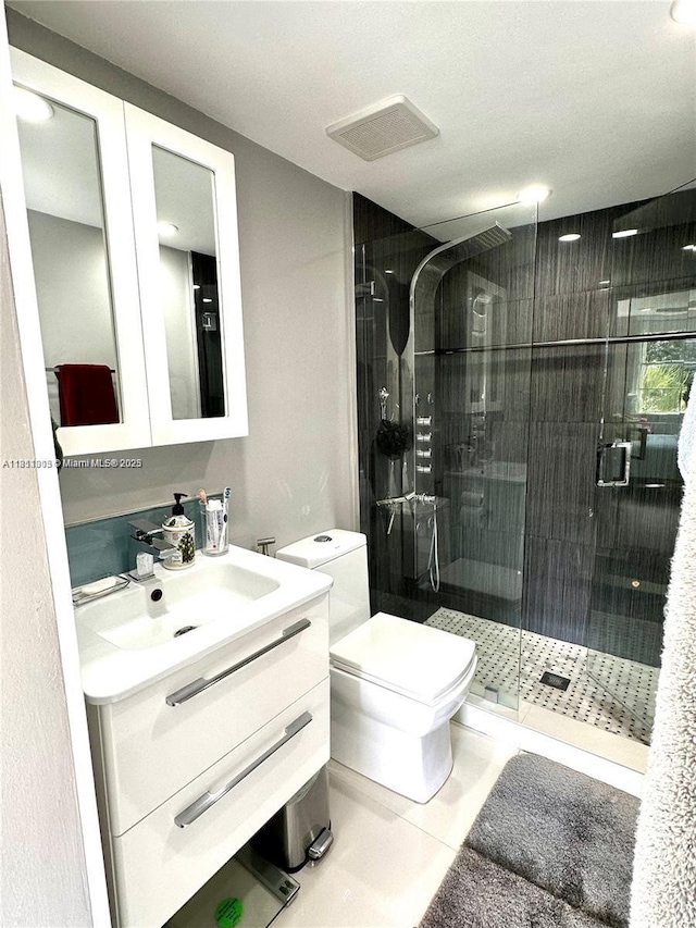 9350 Fontainebleau Blvd Unit 414, Miami, FL 33172 - bathroom featuring vanity, toilet, a stall shower, and tile patterned flooring