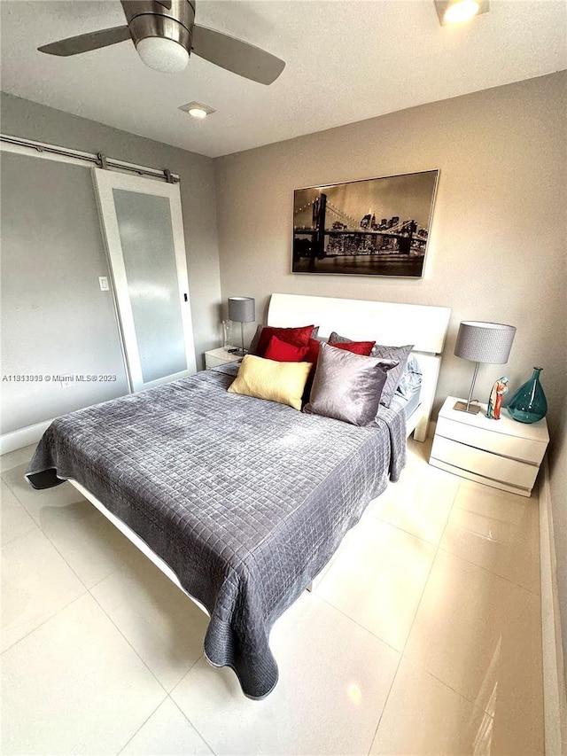 9350 Fontainebleau Blvd Unit 414, Miami, FL 33172 - tiled bedroom featuring a barn door and ceiling fan