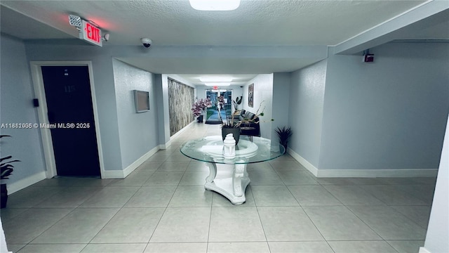 9350 Fontainebleau Blvd Unit 414, Miami, FL 33172 - corridor featuring baseboards, a textured ceiling, and tile patterned floors