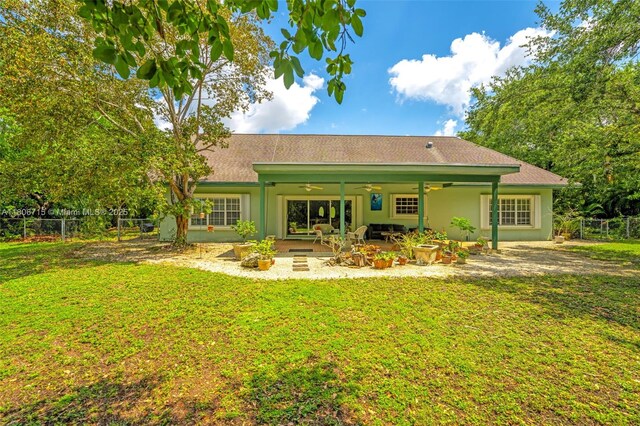 15820 SW 250th St, Homestead, FL 33031 - rear view of property featuring ceiling fan, a patio, a shingled roof, and stucco siding