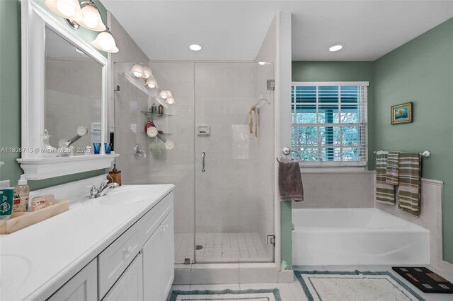 15820 SW 250th St, Homestead, FL 33031 - bathroom featuring double vanity, a bath, tile patterned flooring, a shower stall, and recessed lighting