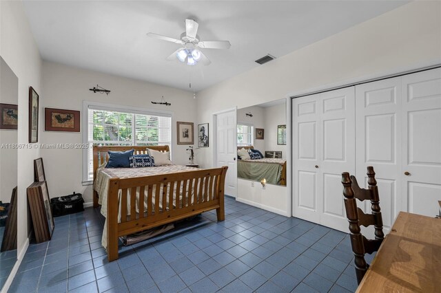 15820 SW 250th St, Homestead, FL 33031 - bedroom with dark tile patterned floors and a ceiling fan