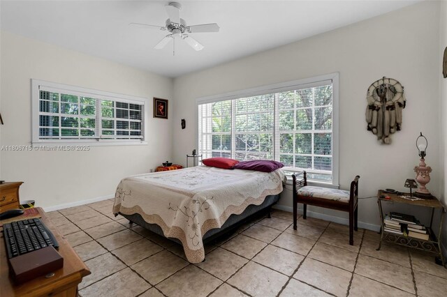 15820 SW 250th St, Homestead, FL 33031 - bedroom with light tile patterned flooring, baseboards, and ceiling fan