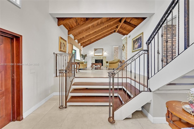 863 W Coco Plum Cir, Plantation, FL 33324 - stairway with wooden ceiling, baseboards, a fireplace, and tile patterned floors
