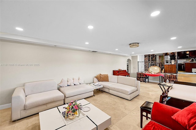 863 W Coco Plum Cir, Plantation, FL 33324 - living room featuring arched walkways, recessed lighting, and baseboards