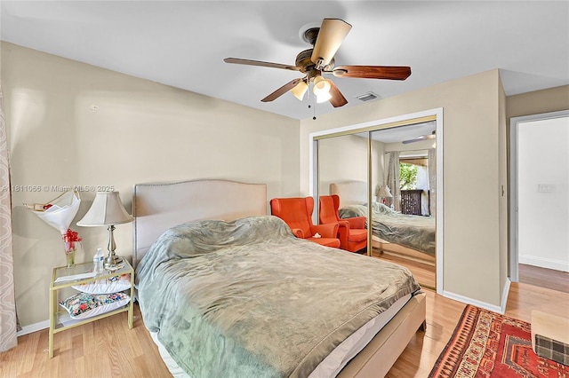 863 W Coco Plum Cir, Plantation, FL 33324 - bedroom featuring a closet, wood finished floors, baseboards, and a ceiling fan