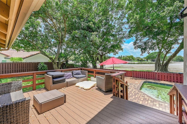 863 W Coco Plum Cir, Plantation, FL 33324 - wooden deck featuring a fenced backyard, an outdoor living space, and a pool