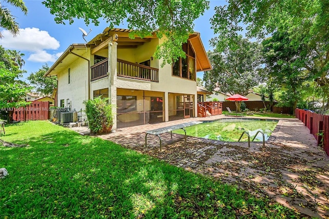 863 W Coco Plum Cir, Plantation, FL 33324 - rear view of property with a balcony, stucco siding, a patio, and central AC unit