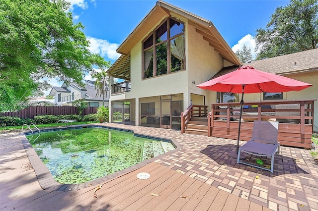 863 W Coco Plum Cir, Plantation, FL 33324 - view of pool featuring a patio area, a deck, and a sunroom