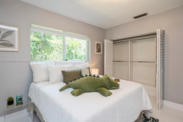 7625 SW 108th Ter, Pinecrest, FL 33156 - bedroom with a closet and baseboards