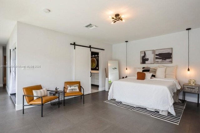 7625 SW 108th Ter, Pinecrest, FL 33156 - bedroom with a barn door, baseboards, and connected bathroom