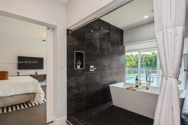 7625 SW 108th Ter, Pinecrest, FL 33156 - full bath featuring tiled shower, a soaking tub, ensuite bath, and baseboards