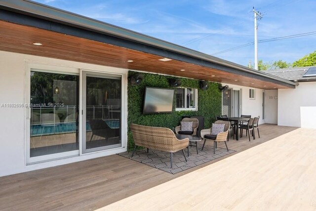 7625 SW 108th Ter, Pinecrest, FL 33156 - view of patio / terrace with a deck and outdoor dining space