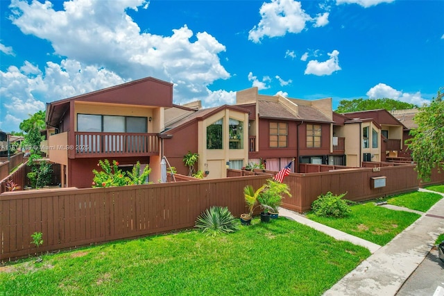 6967 SW 115th Pl Unit B34, Miami, FL 33173 - rear view of house with stucco siding and a residential view