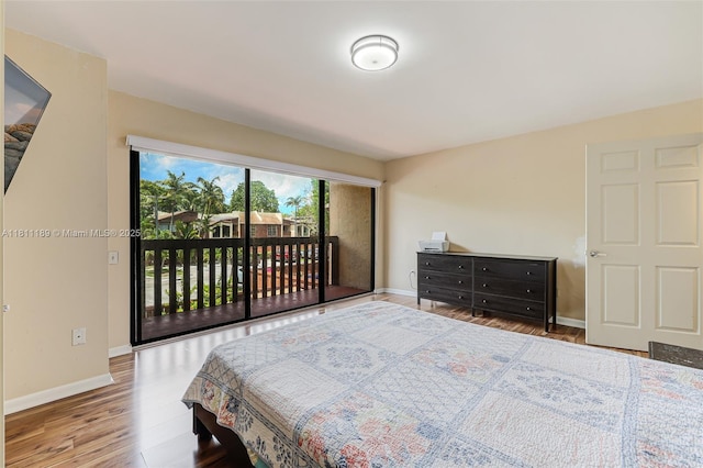 6967 SW 115th Pl Unit B34, Miami, FL 33173 - bedroom featuring wood finished floors, access to outside, and baseboards