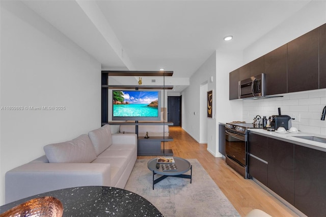 398 NE 5th St Unit 3503, Miami, FL 33132 - living area featuring light wood finished floors, recessed lighting, and baseboards