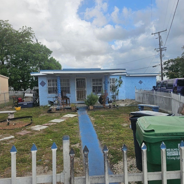 2211 Rutland St, Opa Locka, FL 33054 - view of front facade featuring covered porch