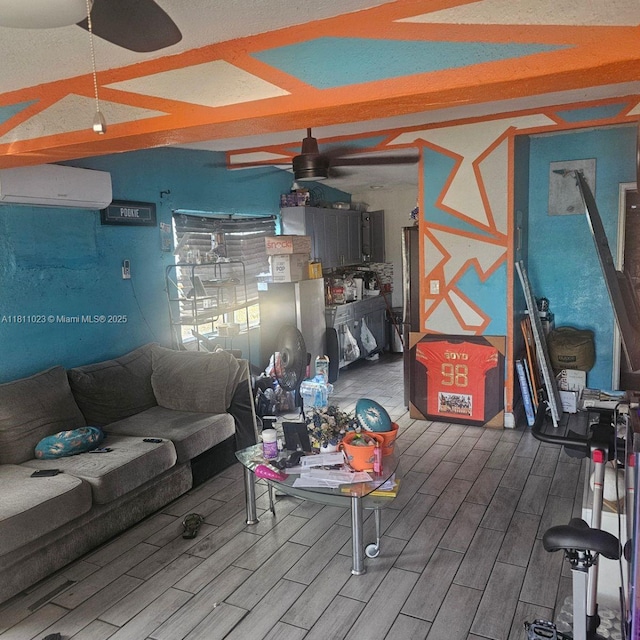 2211 Rutland St, Opa Locka, FL 33054 - living area with a wall mounted air conditioner, ceiling fan, and wood finished floors