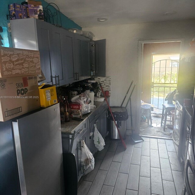 2211 Rutland St, Opa Locka, FL 33054 - kitchen with freestanding refrigerator