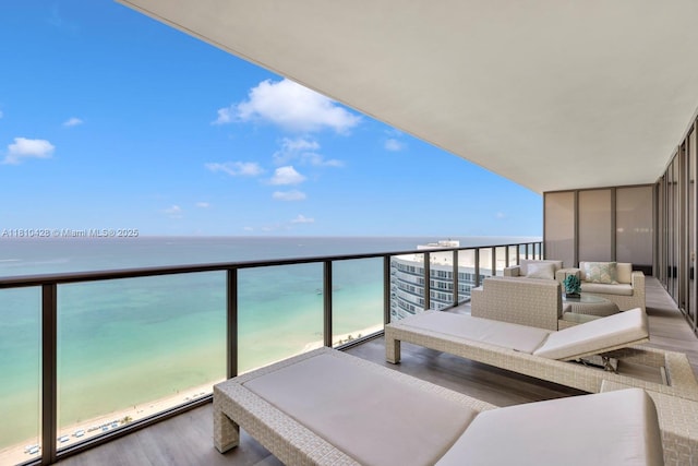 9701 Collins Ave Unit 2403S, Bal Harbour, FL 33154 - balcony with view of water and beach and an outdoor living space