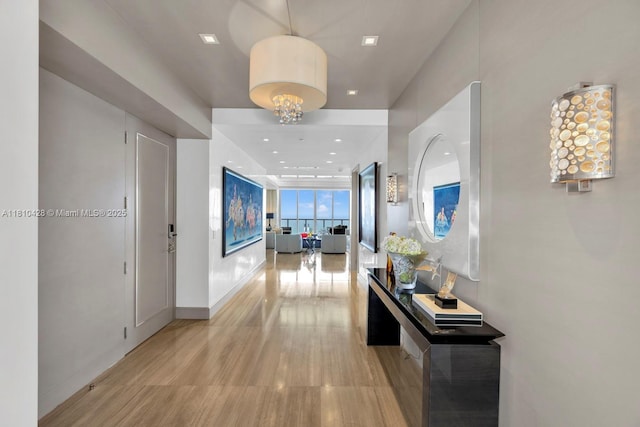 9701 Collins Ave Unit 2403S, Bal Harbour, FL 33154 - hallway featuring light wood finished floors, recessed lighting, and baseboards