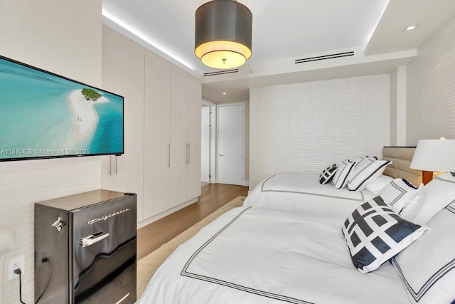 9701 Collins Ave Unit 2403S, Bal Harbour, FL 33154 - bedroom featuring light wood-type flooring