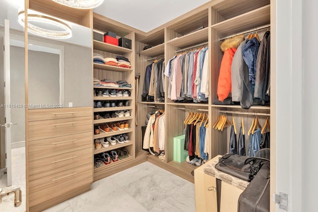 9701 Collins Ave Unit 2403S, Bal Harbour, FL 33154 - walk in closet featuring marble finish floors