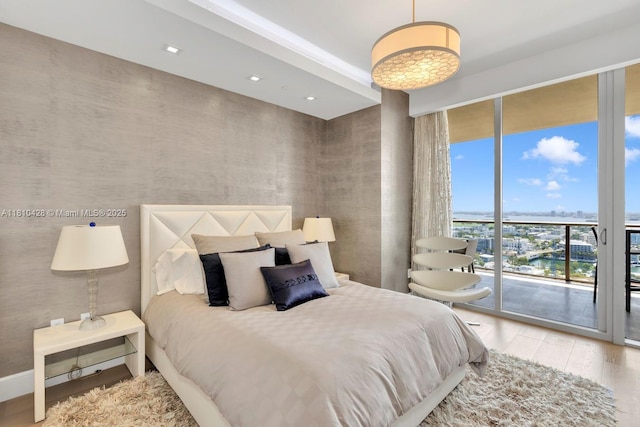 9701 Collins Ave Unit 2403S, Bal Harbour, FL 33154 - bedroom featuring a wall of windows, access to exterior, wood finished floors, and recessed lighting