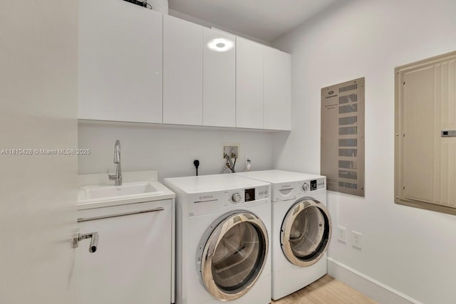 9701 Collins Ave Unit 2403S, Bal Harbour, FL 33154 - laundry area with cabinet space, washing machine and clothes dryer, electric panel, baseboards, and light wood-style flooring