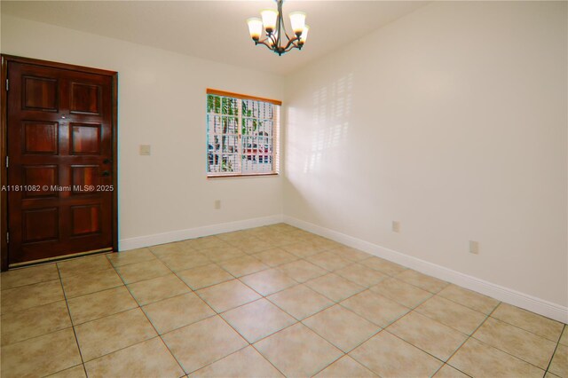 7191 W 24th Ave Unit 31-Ph7, Hialeah, FL 33016 - unfurnished room featuring a chandelier and baseboards
