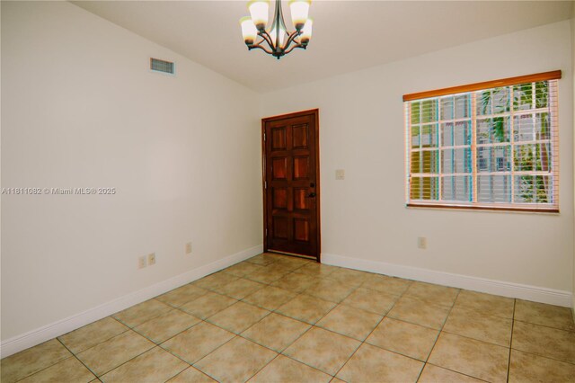 7191 W 24th Ave Unit 31-Ph7, Hialeah, FL 33016 - unfurnished room featuring a chandelier, baseboards, and light tile patterned flooring