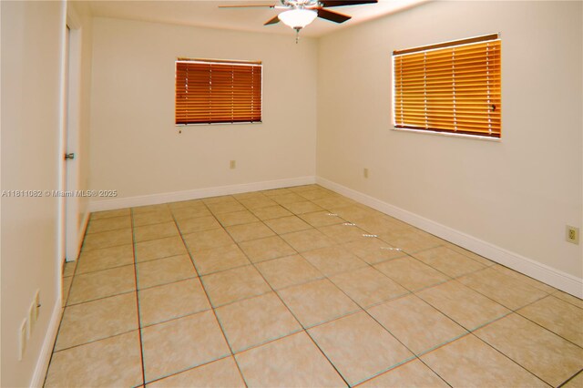 7191 W 24th Ave Unit 31-Ph7, Hialeah, FL 33016 - unfurnished room featuring ceiling fan, tile patterned floors, and baseboards