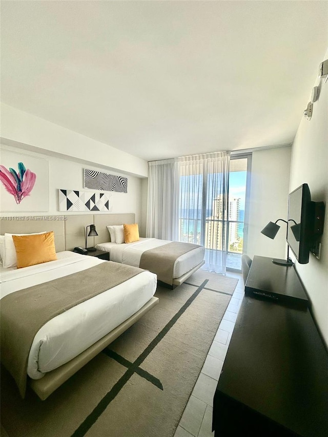4010 S Ocean Dr Unit R1703, Hollywood, FL 33019 - bedroom with access to outside, floor to ceiling windows, and tile patterned flooring