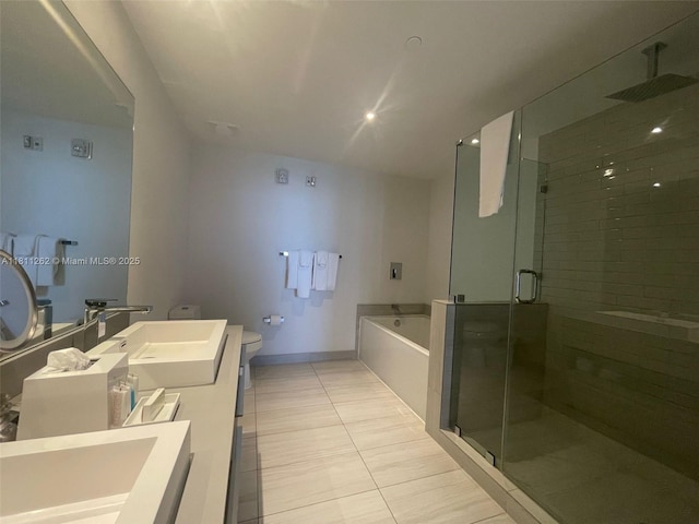 4010 S Ocean Dr Unit R1703, Hollywood, FL 33019 - full bathroom with double vanity, a garden tub, a shower stall, and tile patterned flooring