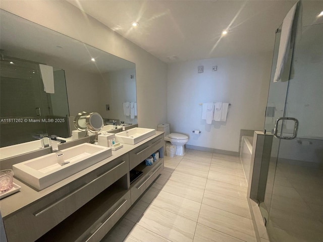 4010 S Ocean Dr Unit R1703, Hollywood, FL 33019 - bathroom featuring double vanity, a shower stall, and a bath