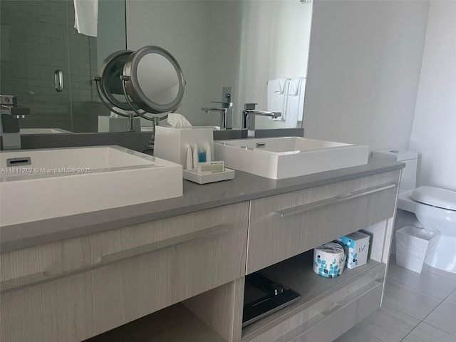 4010 S Ocean Dr Unit R1703, Hollywood, FL 33019 - bathroom with double vanity, tile patterned flooring, and a stall shower