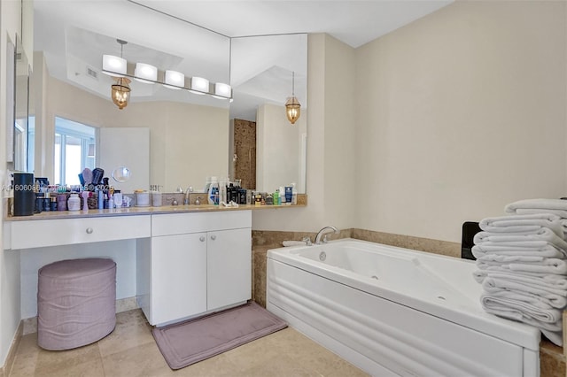 4779 Collins Ave Unit 4006, Miami Beach, FL 33140 - full bathroom with a jetted tub, vanity, and tile patterned floors