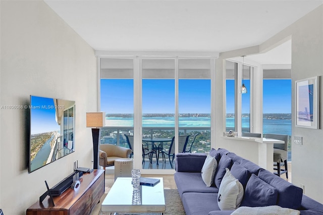 4779 Collins Ave Unit 4006, Miami Beach, FL 33140 - living room with expansive windows, plenty of natural light, and a water view