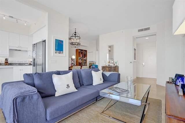 4779 Collins Ave Unit 4006, Miami Beach, FL 33140 - living room with a chandelier and track lighting