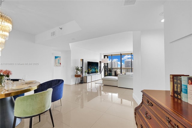 1000 Island Blvd Unit 2508, Aventura, FL 33160 - dining room featuring a chandelier, light tile patterned floors, and baseboards