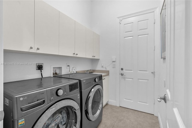 5342 SW 173rd Ave, Miramar, FL 33029 - laundry room featuring cabinet space, washing machine and clothes dryer, light tile patterned flooring, and baseboards