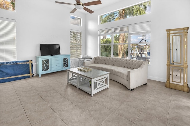 5342 SW 173rd Ave, Miramar, FL 33029 - living area featuring a towering ceiling, ceiling fan, plenty of natural light, tile patterned floors, and baseboards