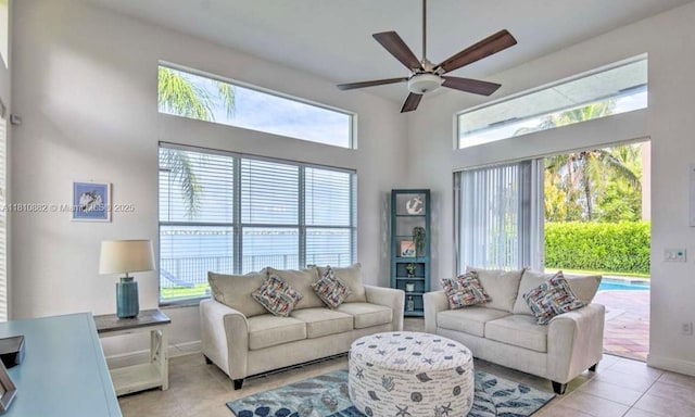 5342 SW 173rd Ave, Miramar, FL 33029 - living room with light tile patterned flooring, ceiling fan, plenty of natural light, and a towering ceiling
