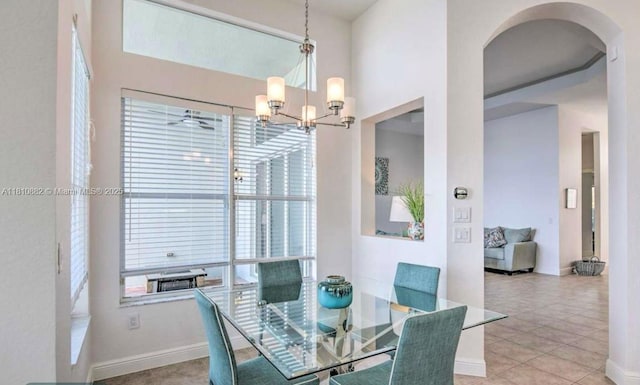 5342 SW 173rd Ave, Miramar, FL 33029 - tiled dining area featuring arched walkways, a chandelier, and baseboards