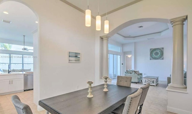 5342 SW 173rd Ave, Miramar, FL 33029 - dining space with arched walkways, decorative columns, light tile patterned floors, ceiling fan, and a tray ceiling